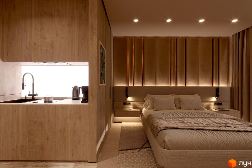 Інтер'єр апартаментів Комплексу Forrest Resort & SPA: об'єднані зони кухні з дерев'яними шафами та спальні з ліжком і підсвічуванням.
