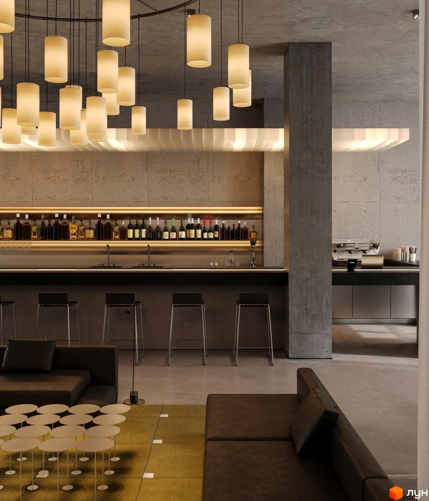 Інтер'єр лобі-бару в Circle hotel&apartments з бетонними стінами, підвісними лампами та м'якими диванами.