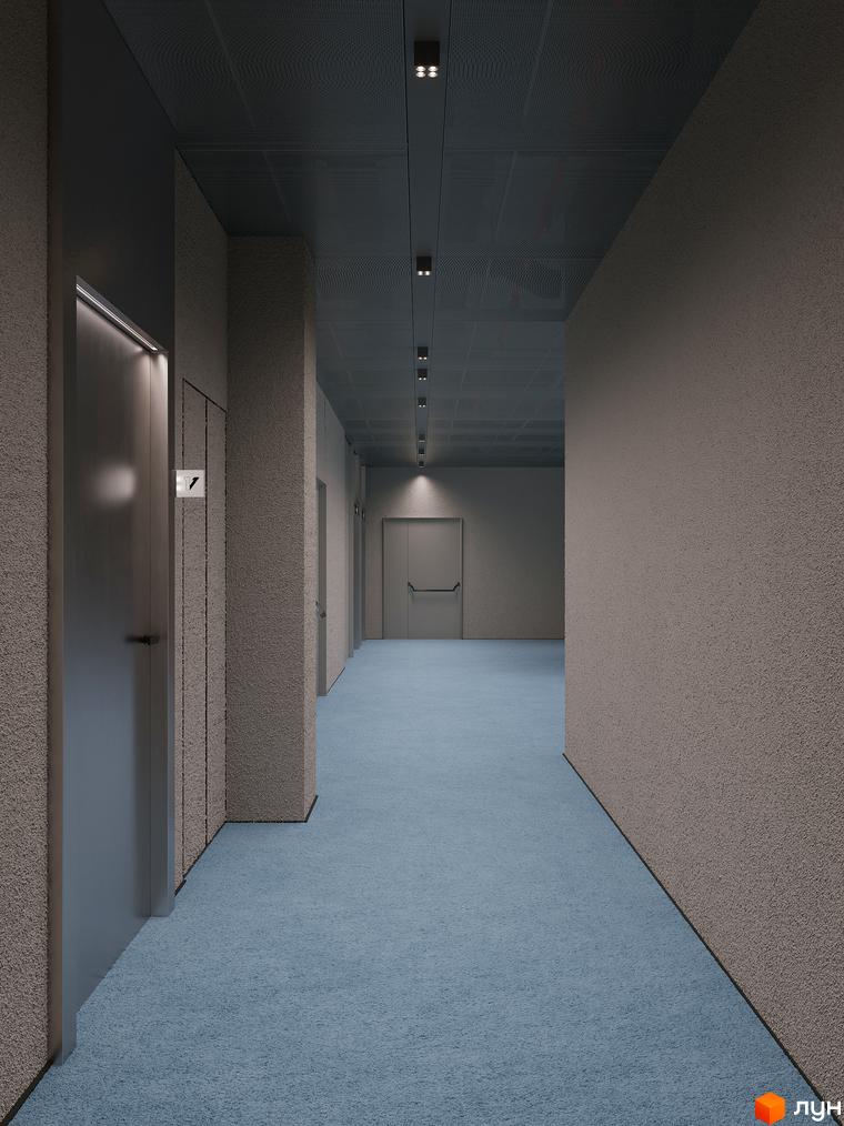 Коридор у Circle hotel&apartments з ліфтом та синім килимовим покриттям. Інтер'єр загальних зон новобудови.
