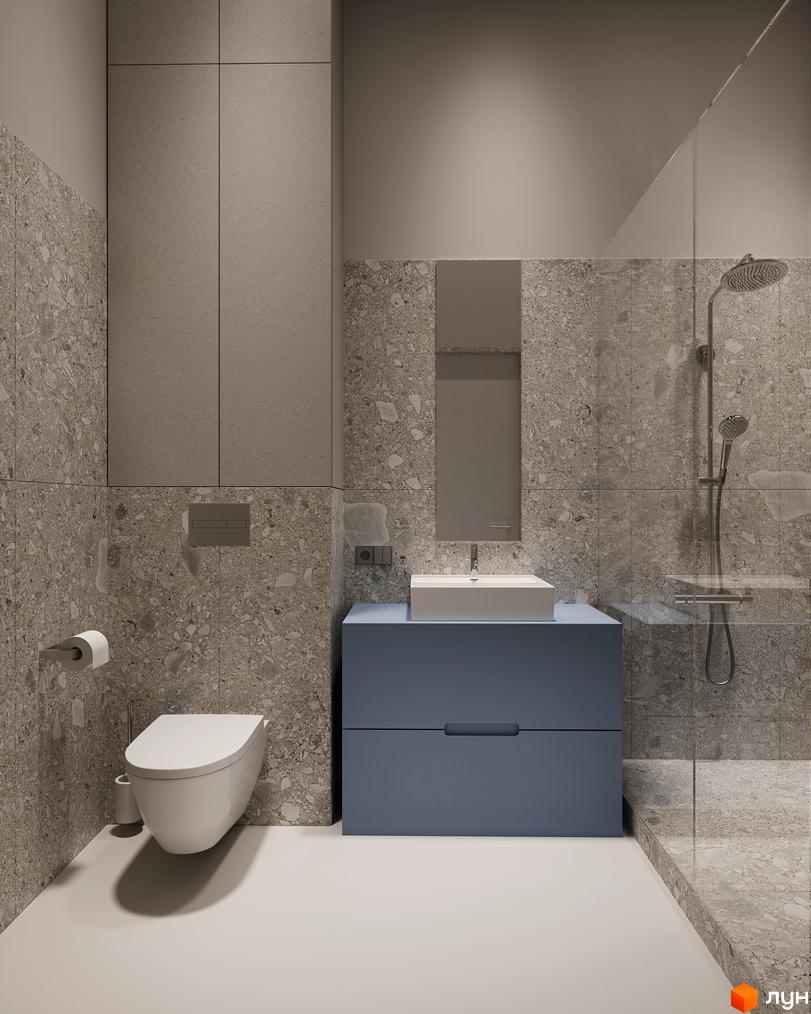 Інтер'єр ванної кімнати в Circle hotel&apartments: стіни з тераццо, підвісний унітаз, синя тумба з раковиною та скляна душова кабіна.