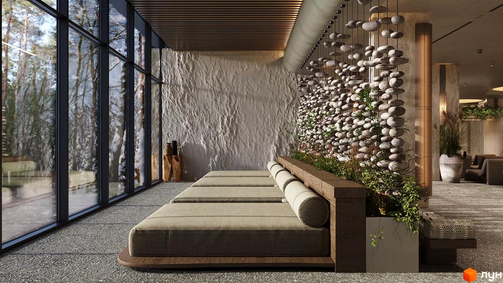 Панорамні вікна в Son Daven відкривають вид на зимовий ліс. Зона відпочинку з кам'яними стінами, зручними лежаками та рослинним декором.