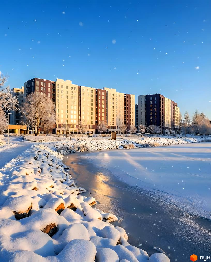 Житловий комплекс Lavanda Park з сучасними будинками на фоні зимового пейзажу та замерзлого водоймища.