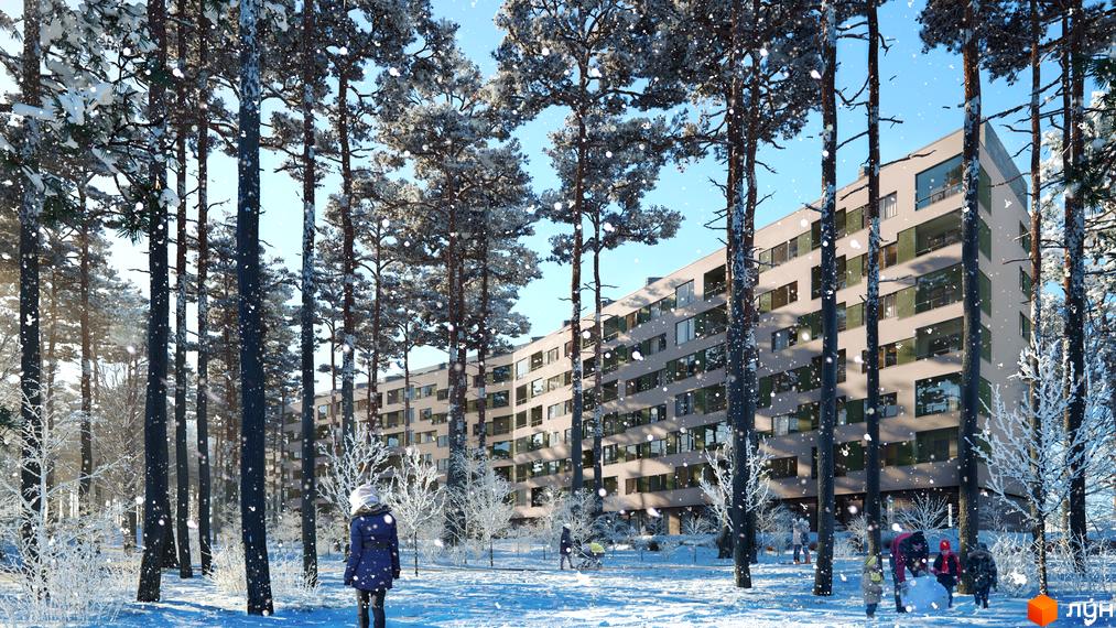 Житловий комплекс Park Town серед засніжених дерев. Багатоповерховий будинок з великими вікнами та доглянутою прибудинковою територією.