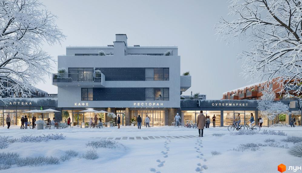 Зовнішній вигляд житлового комплексу Greenville Prostir з кафе, аптекою та супермаркетом на зимовій прибудинковій території.