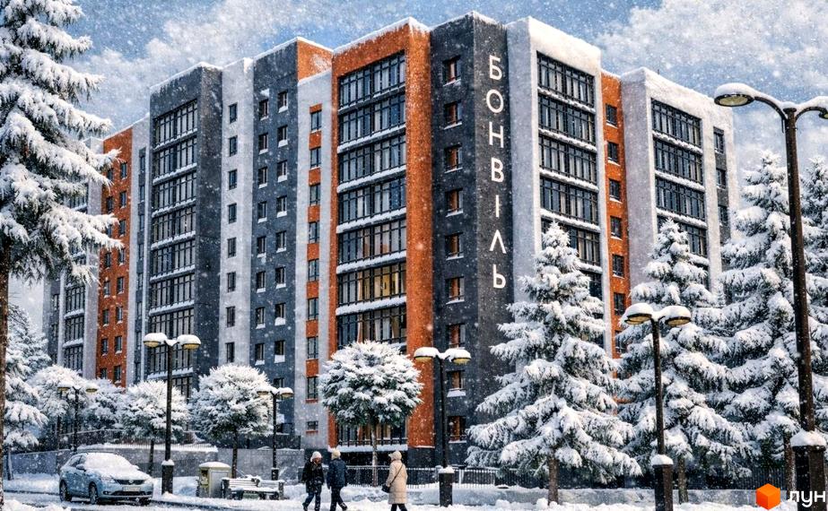 Житловий комплекс Бонвіль, фасад будинку з великими вікнами та прибудинкова територія, засніжена з деревами.