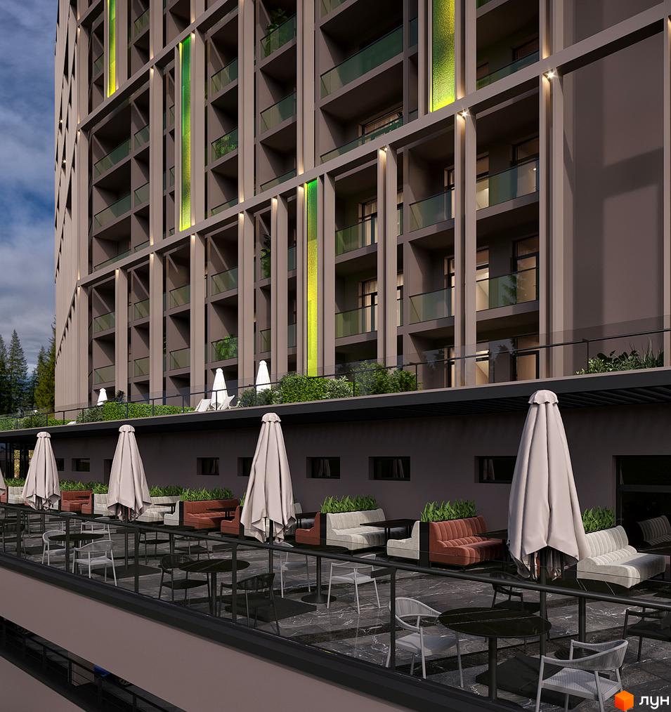 Фасад Апарт-комплексу KARDAMON LIFESTYLE RESORT & SPA з балконами та зеленими елементами. Прибудинкова територія з зонами відпочинку та столиками.