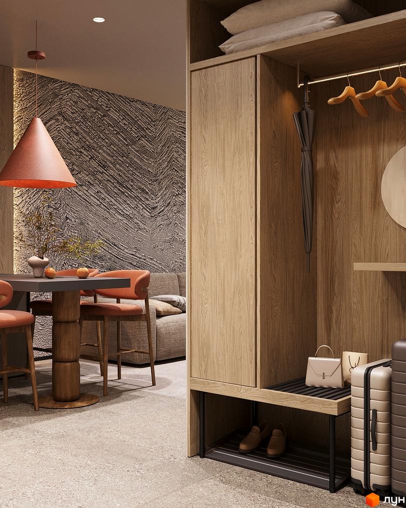 Інтер'єр квартири в ЖК Logos Home Apartment з обідньою зоною та шафою для зберігання.