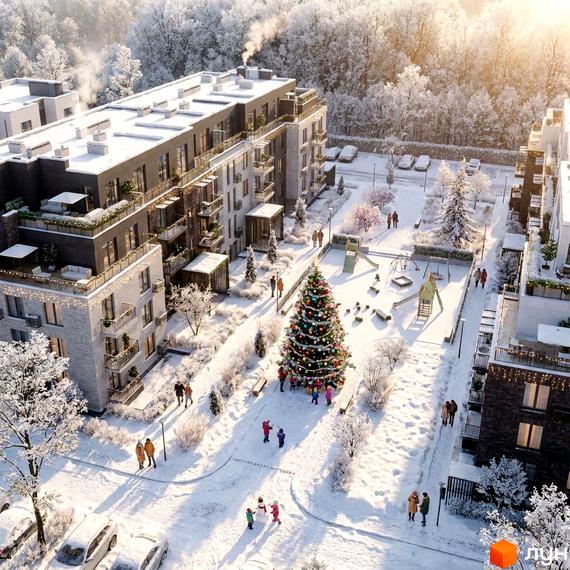 Житловий комплекс FAMILY PARK APARTMENS з сучасними будинками та прибудинковою територією, прикрашеною новорічною ялинкою.