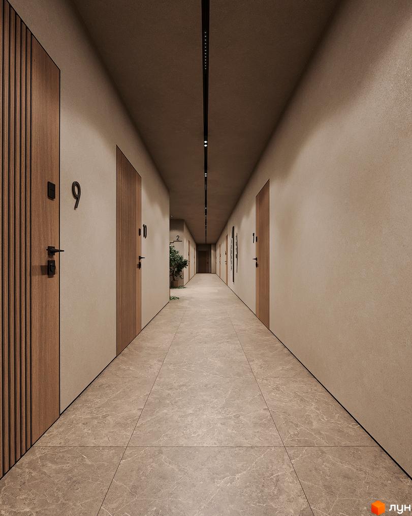 Коридор житлового комплексу ЖК КОРОНА з дверима квартир та рослинністю. Сучасна підлога та освітлення створюють комфортну атмосферу.