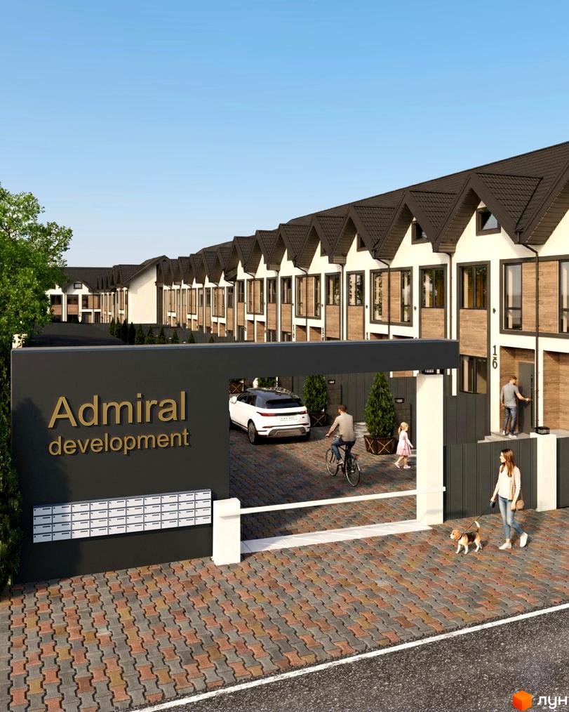 Житловий комплекс Таунхауси 40 Estates з сучасними будинками та прибудинковою територією, де гуляють люди з собаками.