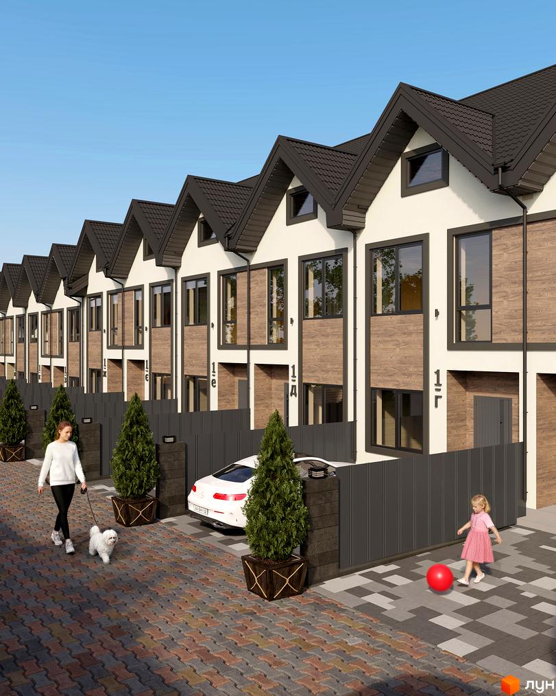 Зовнішній вигляд Таунхаусів 40 Estates з прибудинковою територією, де гуляють жінка з собакою та дитина.