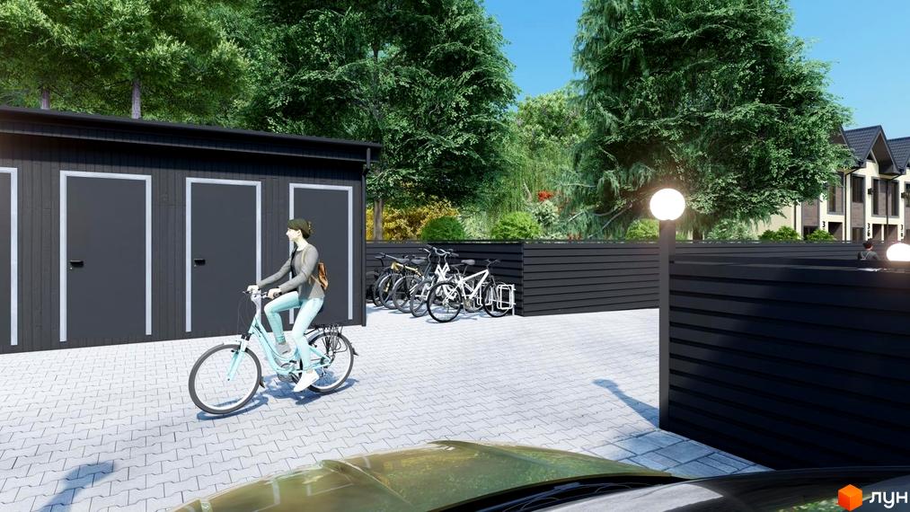 Зовнішній вигляд та прибудинкова територія житлового комплексу Таунхауси 40 Estates з велосипедистом та паркувальними місцями.