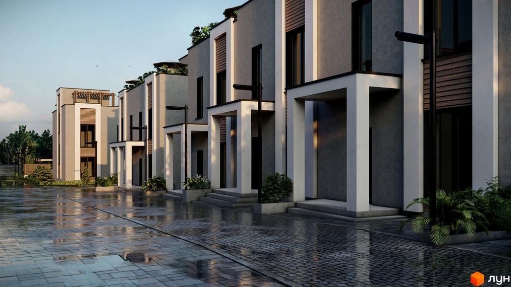 Котеджне містечко The Lake: ряд котеджів з сірими фасадами, білими рамами та дерев'яними вставками. Мокра бруківка та зелені насадження біля будинків.