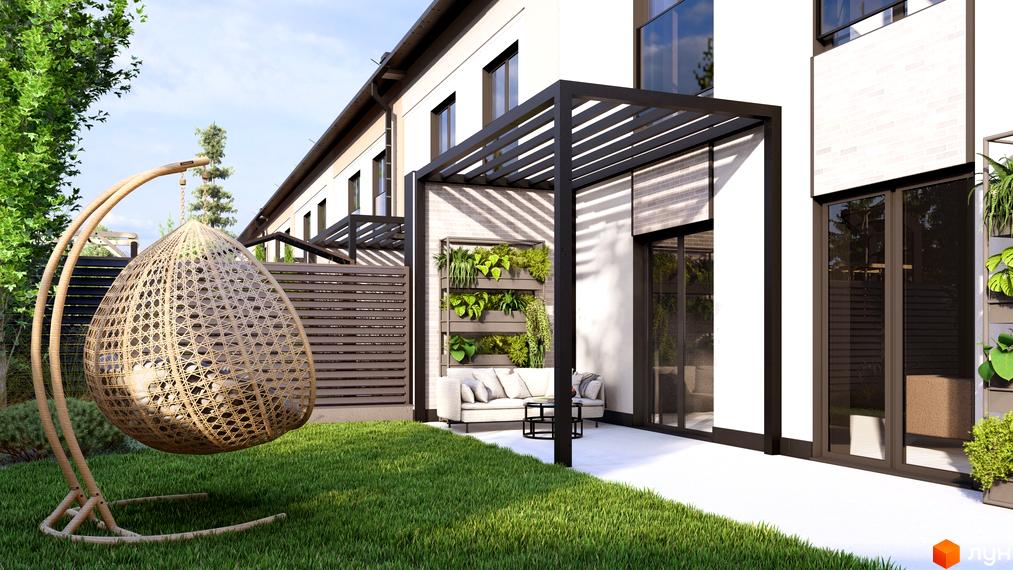 Зовнішній вигляд таунхаусів Svoie Birky з зеленим газоном та зоною для відпочинку. Прибудинкова територія оформлена рослинами та затишними меблями.