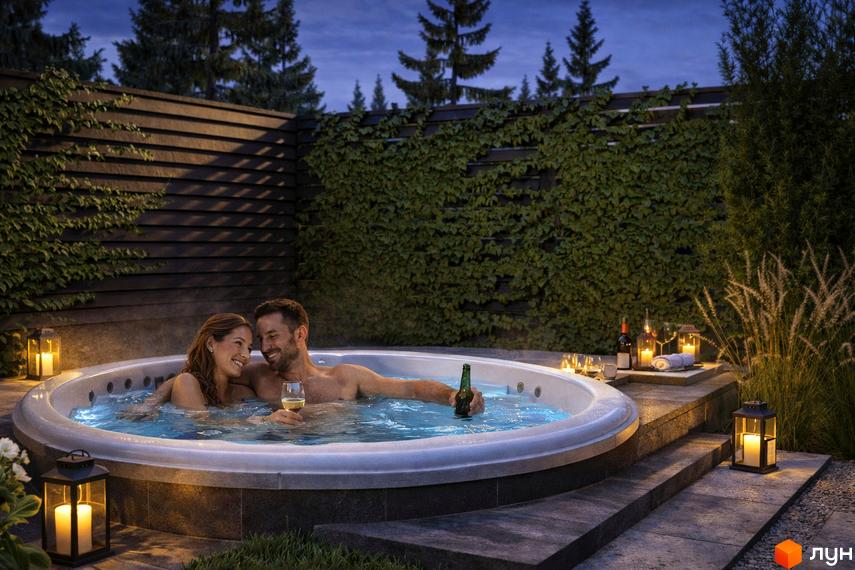 Сучасний таунхаус Svoie Birky з джакузі на прибудинковій території, оточений зеленню та освітленням.