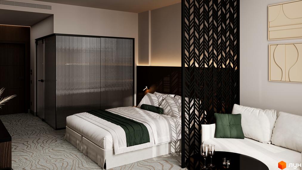 Інтер'єр номера в GRAND SPA RESORT AND CONFERENCE з ліжком, диваном та сучасними елементами декору.