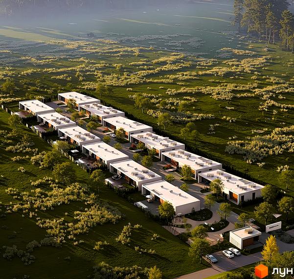 Котеджне містечко KHUTIR з одноповерховими будинками світлого кольору. Територія оточена зеленими насадженнями та доглянутими газонами.