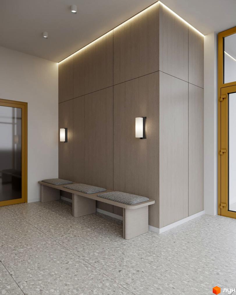 Вхідна зона Житлового комплексу Lumen з дерев'яними панелями, лінійним та настінним освітленням. На підлозі світла плитка тераццо, стоять лави з подушками.