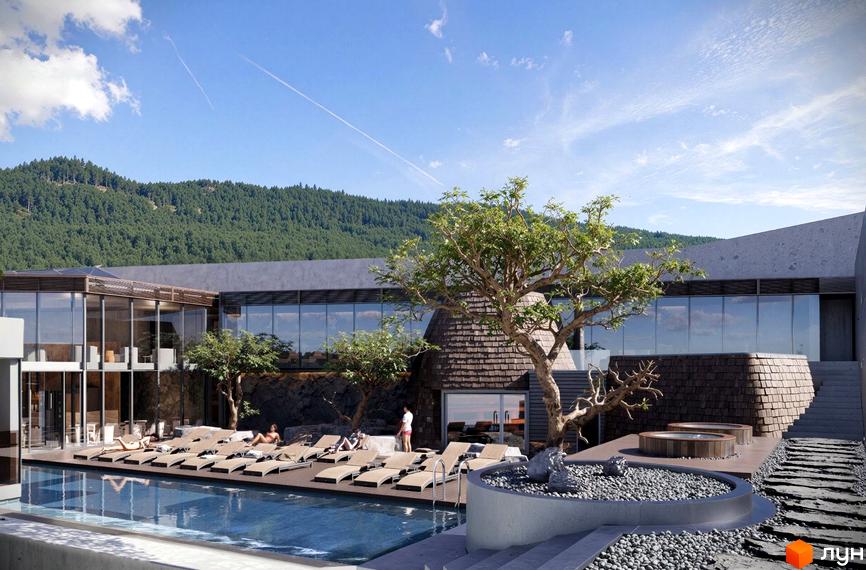 Котеджне містечко FOMICH TOWN з басейном та зоною відпочинку на тлі гірського пейзажу. Сучасна архітектура комплексу з великими вікнами та дерев'яними елементами.