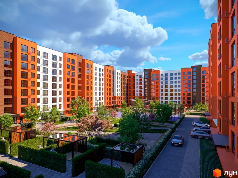 Житловий комплекс Перлина Проскурова-5 з яскравим фасадом та доглянутою прибудинковою територією з зеленими насадженнями та зонами відпочинку.