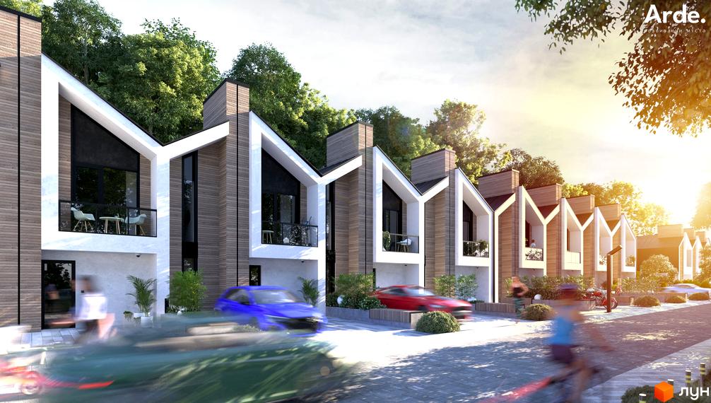 Котеджне містечко KOLO 32. Ряд будинків з дерев'яним оздобленням та білими кутовими фасадами, балконами. Прибудинкова територія з дорогою та зеленню.