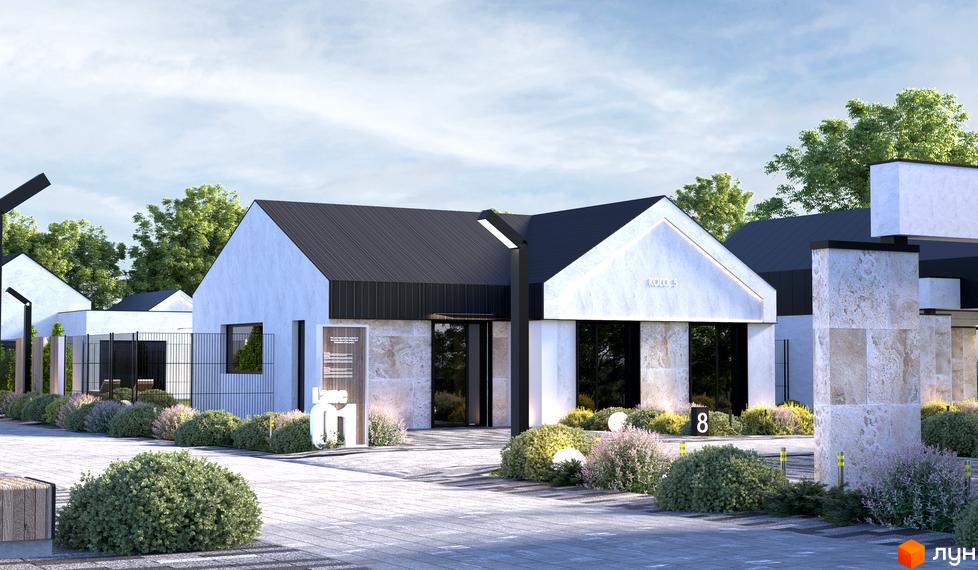 Білий будинок Котеджного містечка KOLO 32 з темним дахом та кам'яним облицюванням. Прибудинкова територія має доріжки, зелені насадження та освітлення.