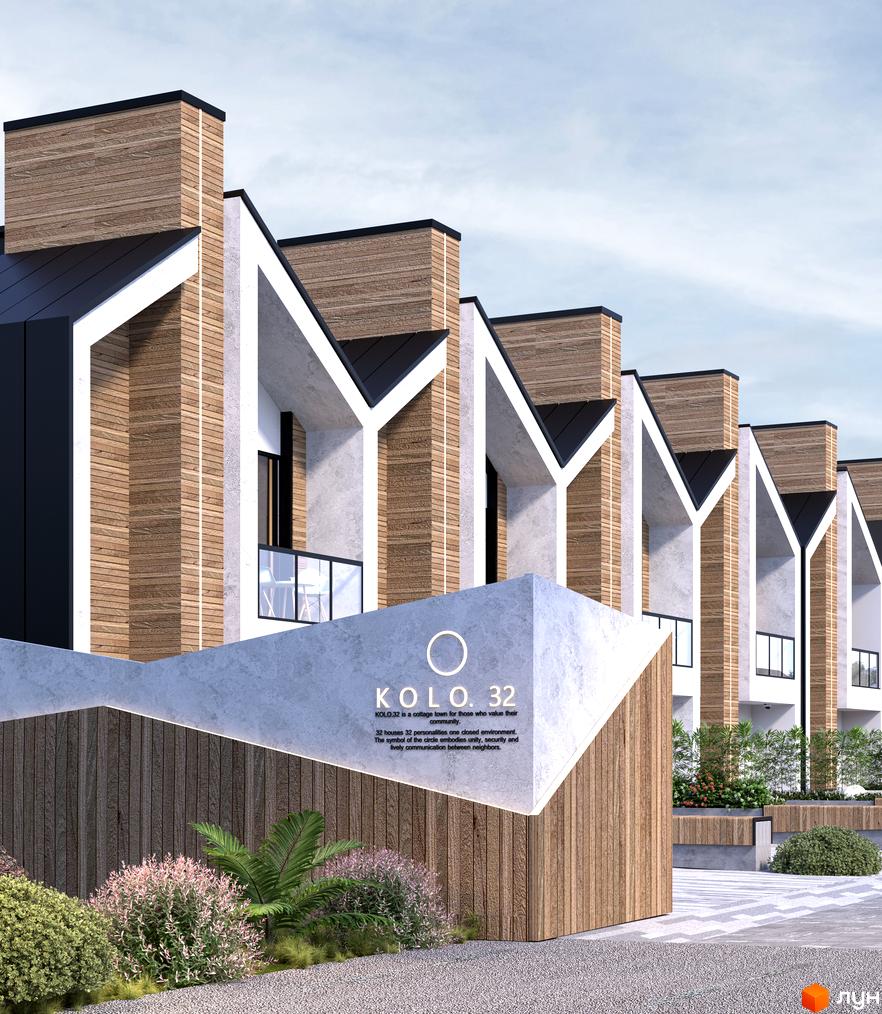 Котеджне містечко KOLO 32 з дерев'яними фасадами та білими акцентами, прибудинкова територія з ландшафтним дизайном.