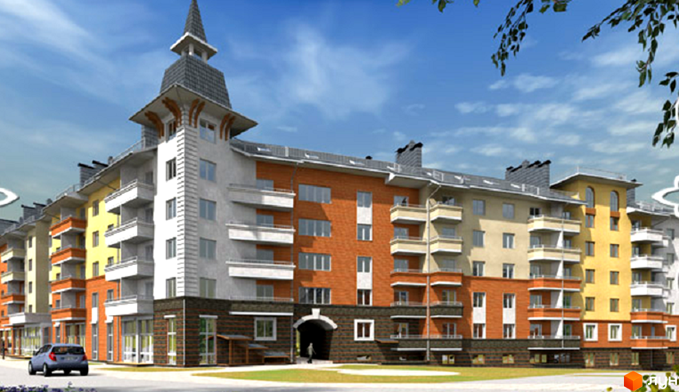 Житловий комплекс Хотів: багатоповерховий будинок з різнокольоровими фасадами, балконами та арковим проїздом, розташований біля дороги та зеленого газону.