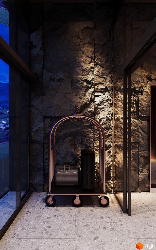 Лобі Апарт-готелю IKON Resort з оздобленням кам'яними стінами та панорамними вікнами. З вікон відкривається вид на гірський ландшафт.