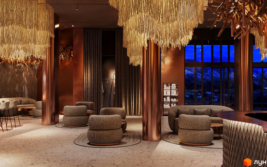 Інтер'єр апарт-готелю IKON Resort з розкішними люстрами, м'якими меблями та панорамними вікнами з видом на гори.