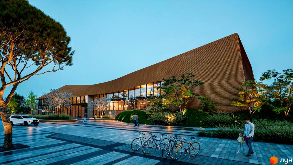 Апарт-готель ONOKY River Club з дерев'яним фасадом та великими вікнами, оточений зеленню та доглянутою прибудинковою територією з велосипедами.