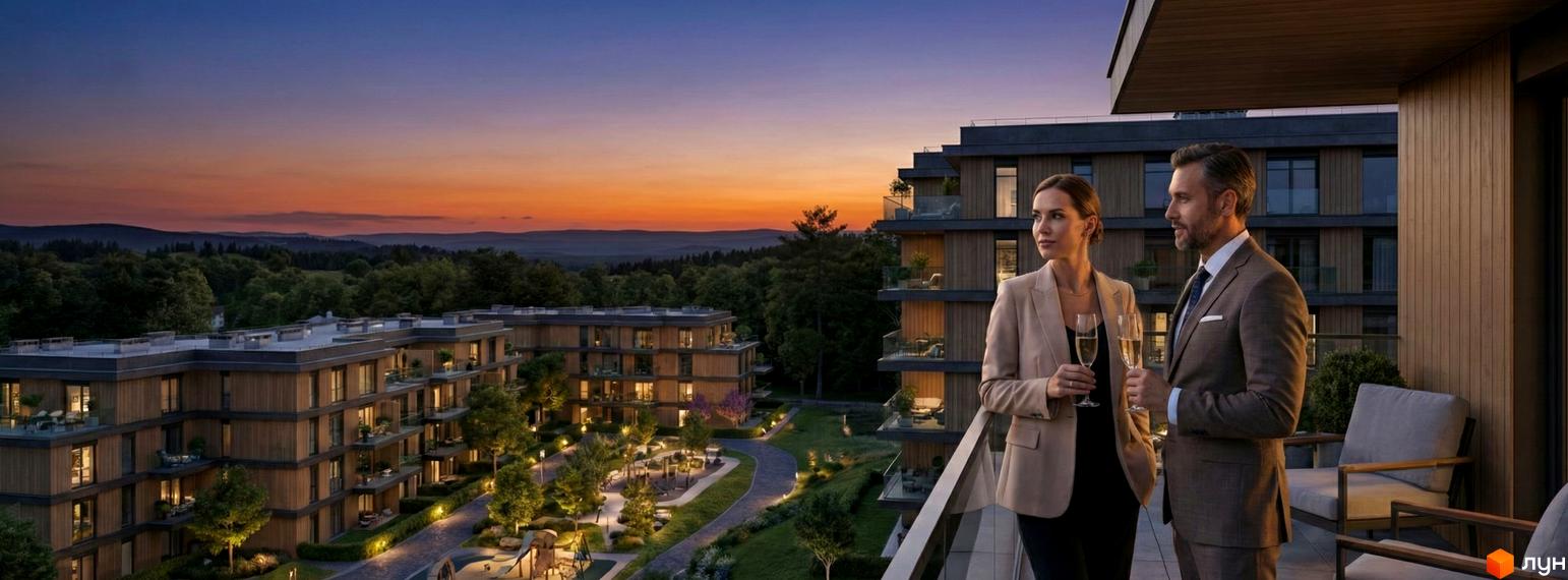 Багатоквартирні будинки Житлового комплексу AURA з дерев'яними фасадами та заскленими балконами. Прибудинкова територія має освітлені доріжки та ландшафтний дизайн.