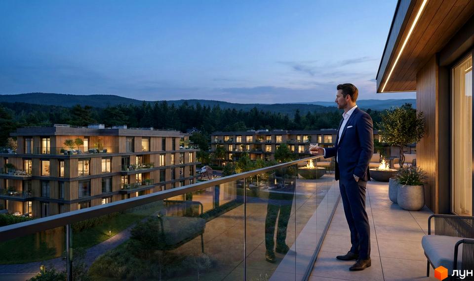 Житловий комплекс AURA. Будинки з дерев'яними фасадами та балконами, освітлені ввечері, з облаштованими терасами та видом на ліс.