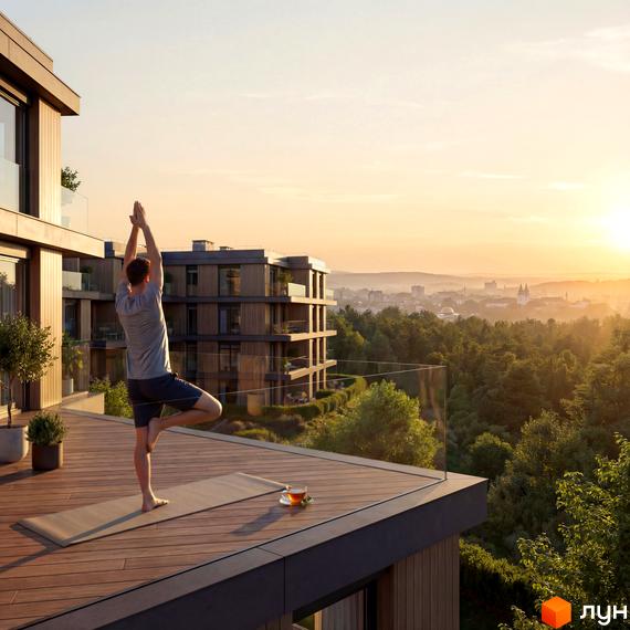 Житловий комплекс AURA: багатоквартирний будинок з дерев'яним оздобленням та великими терасами, що має панорамний вид на ліс та місто на заході сонця.