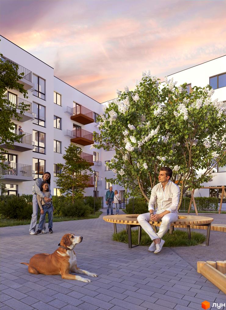 Житловий комплекс Субурбія Соло: білі будинки з балконами, озеленена прибудинкова територія з лавками та дитячим майданчиком.