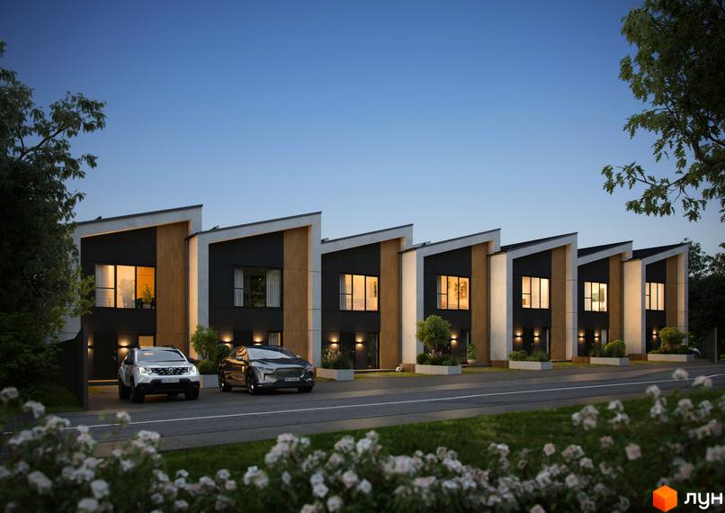 Ряд двоповерхових будинків з темними фасадами, дерев'яними вставками та похилими дахами. Перед ними дорога, газони та квітучі кущі.