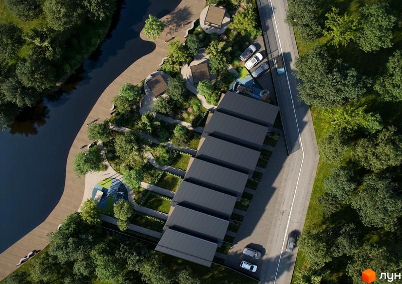 Аерофотозйомка житлового комплексу на вул. Вітавська, 32, з паркуванням та зонами відпочинку біля річки.