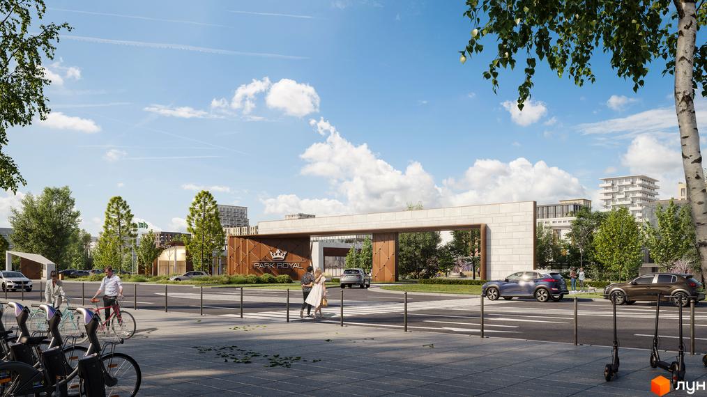 В'їзд до Житлового комплексу PARK ROYAL з великою аркою, виконаною з каменю та панелей. Перед входом облаштована дорога, пішохідний перехід та зелені зони.