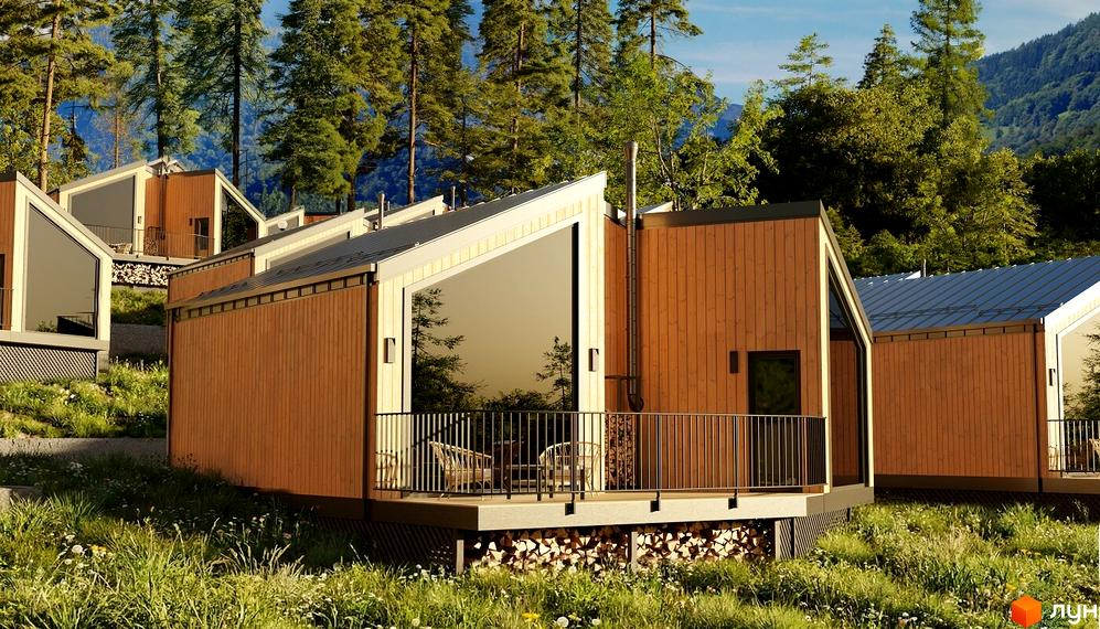 Котеджне містечко КМ Теплий: дерев'яні будинки з великими вікнами та терасами на тлі лісу. Прибудинкова територія з травою та дровами.