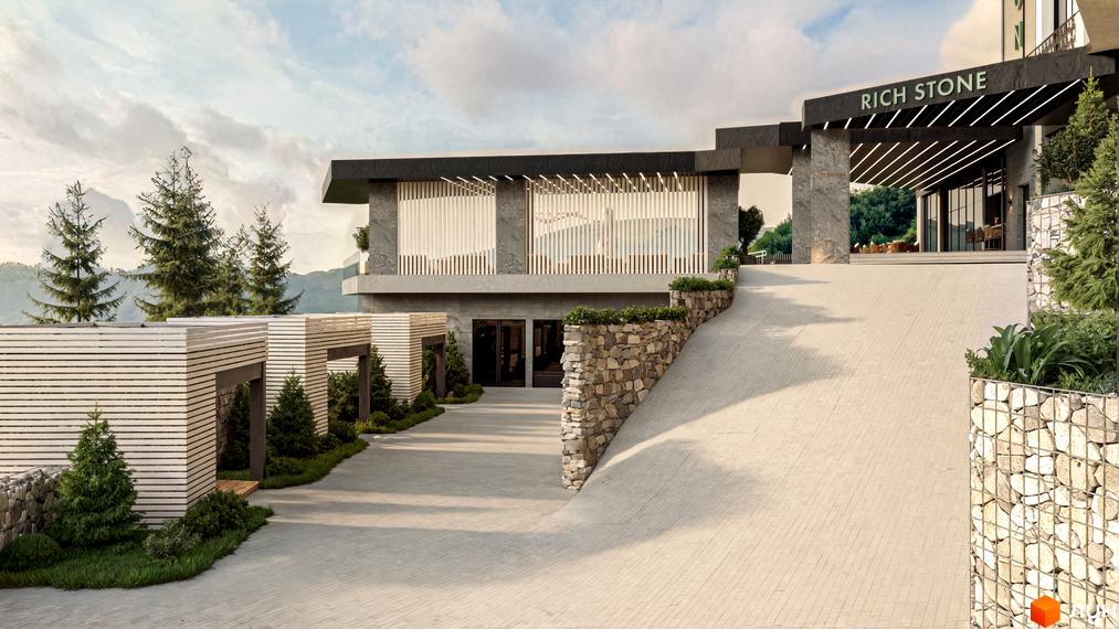 Апарт-готель Rich Stone Family Club з кам'яною облицовкою та дерев'яними елементами. Територія комплексу з доріжками, газонами та хвойними деревами.