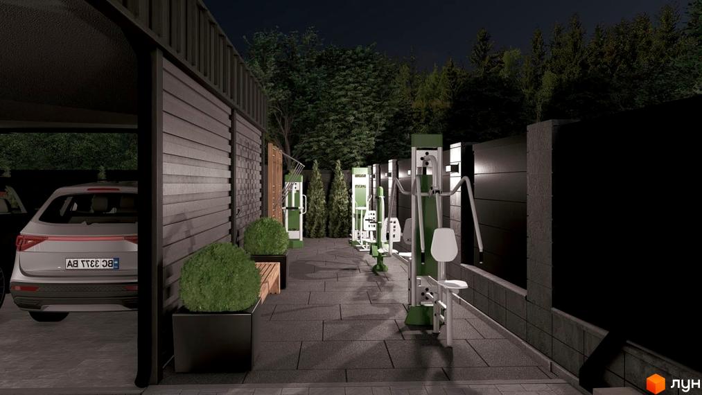 Стіна з темною горизонтальною обшивкою та навісом для автомобіля. На прибудинковій території розташовані вуличні тренажери та зелені насадження.