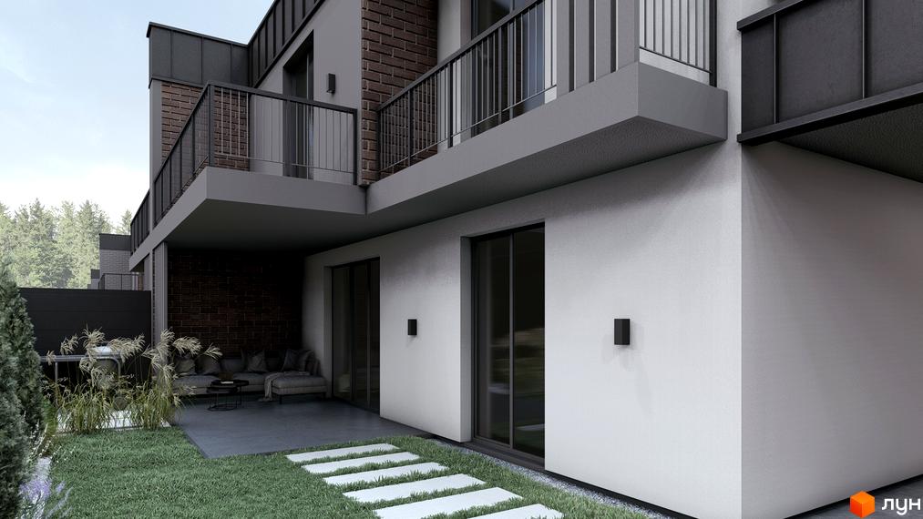 Зовнішній вигляд новобудови з цегляними та сірими фасадами, балконами та прибудинковою територією з газоном і стежками.