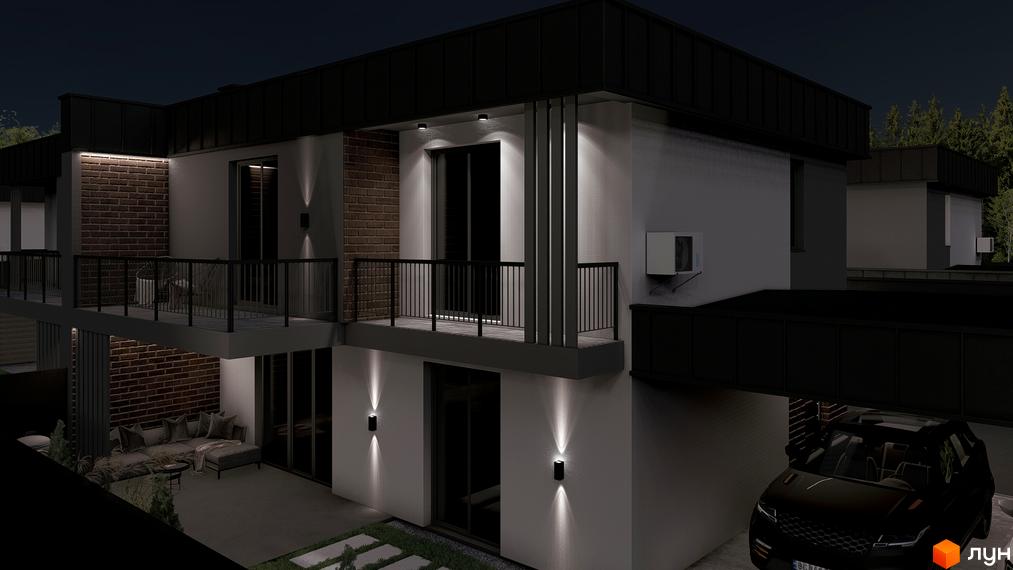 Багаторівневий будинок з білими фасадами, цегляними акцентами та балконами, освітлений вночі. На прибудинковій території є зона відпочинку та парковка.