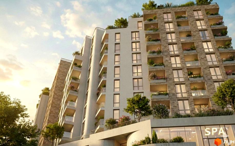 Житловий комплекс SHELEST Residence & SPA. Зовнішній вигляд новобудови з балконами та зеленню, фасад оздоблений каменем та білою штукатуркою.