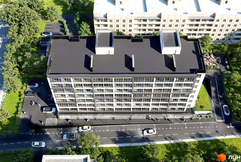 Житловий комплекс Prostir комфорту з білим фасадом, численними вікнами та темним дахом. Прибудинкова територія включає парковки, зелені насадження та дитячий майданчик.