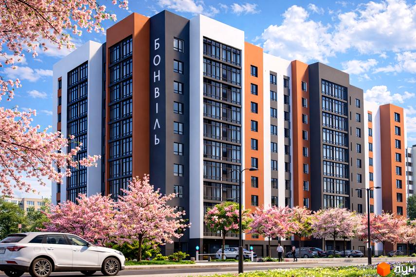 Житловий комплекс Бонвіль: багатоповерховий будинок з фасадом у помаранчевих, сірих та білих кольорах, оточений квітучими рожевими деревами.