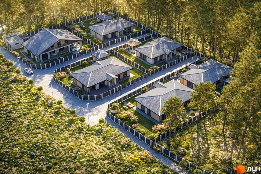 Вид зверху на Котеджне містечко Lubo Village: будинки з сірими дахами та світлими фасадами, оточені доглянутими подвір'ями та лісом.