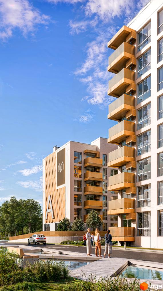 Житловий комплекс AUROOM DISTRICT має світлі багатоповерхові будинки з балконами, оздобленими дерев'яними панелями. Територія включає водні об'єкти, зелені насадження та пішохідні зони.