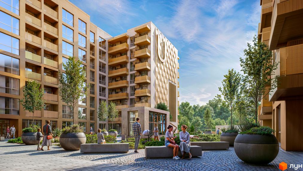 Житловий комплекс AUROOM DISTRICT: багатоповерхові будинки світло-коричневого кольору з балконами та рельєфним фасадом. Прибудинкова територія з доріжками, лавками та зеленими насадженнями.
