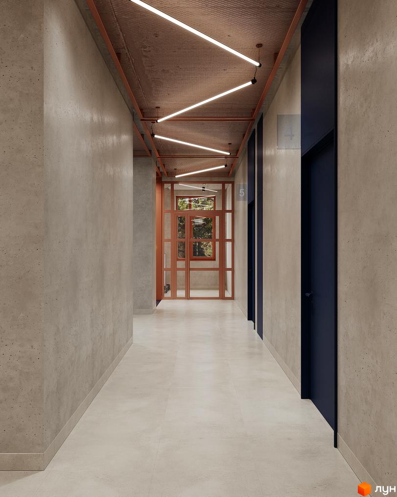 Коридор Житловий комплекс AUROOM DISTRICT: бетонні стіни, світла підлога, стеля з металевою сіткою та лінійним освітленням. Вдалині проглядається вікно.
